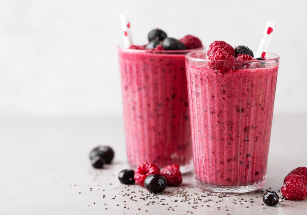 two berry smoothies with Greek yogurt and striped straws