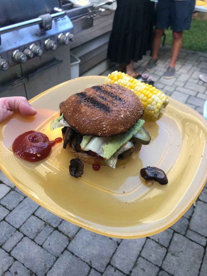 burger on a plate with mushrooms