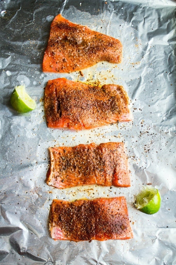 seasoned salmon fillets on foil