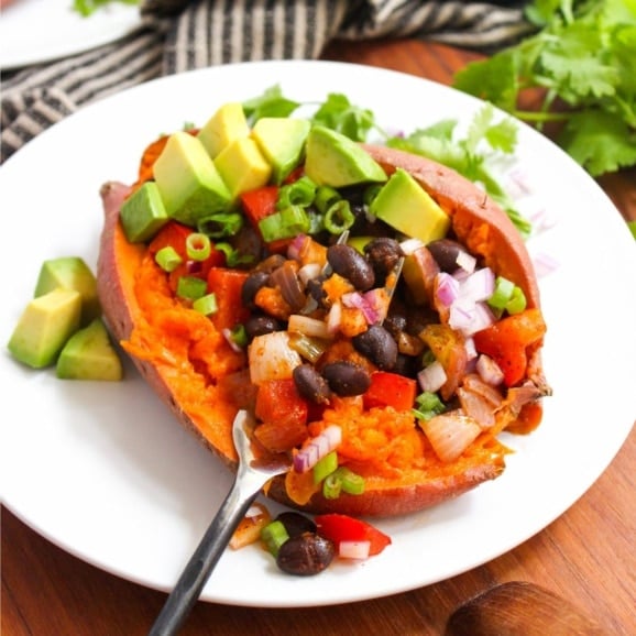 healthy stuffed sweet potato with black beans and avocado