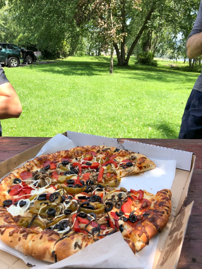 pizza with grass behind