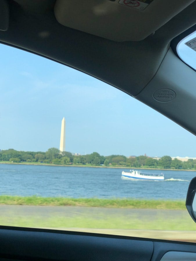 view of washington monument from the car
