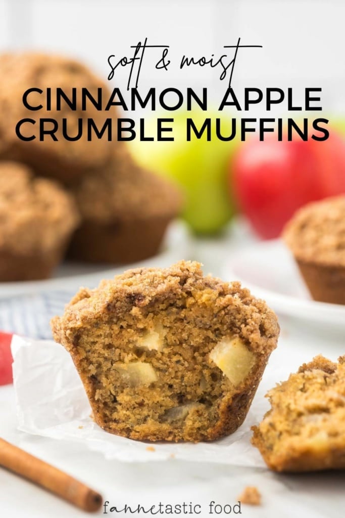 cinnamon apple muffins with crumble topping on parchment paper