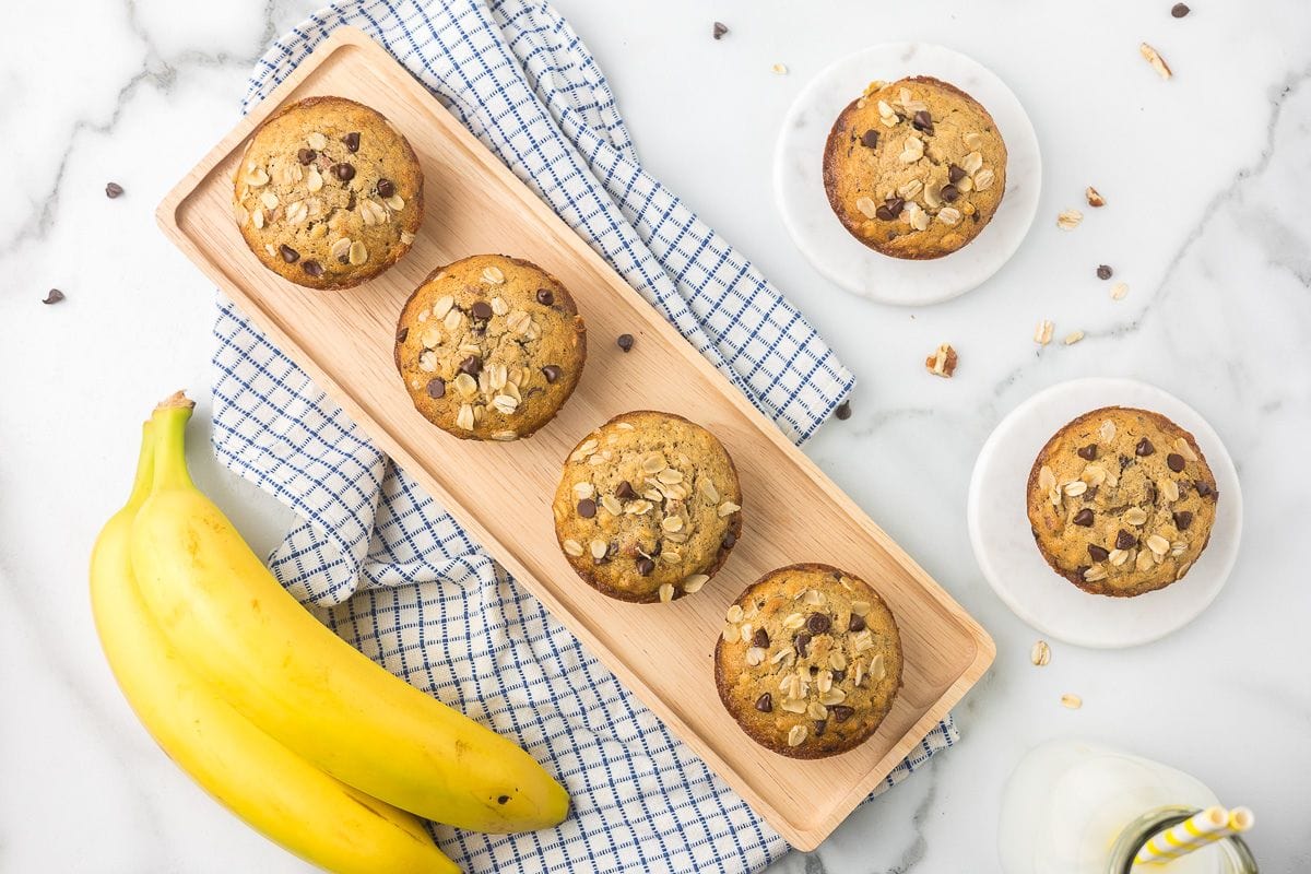 gluten free banana chocolate chip muffins in a blue and white kitchen towel