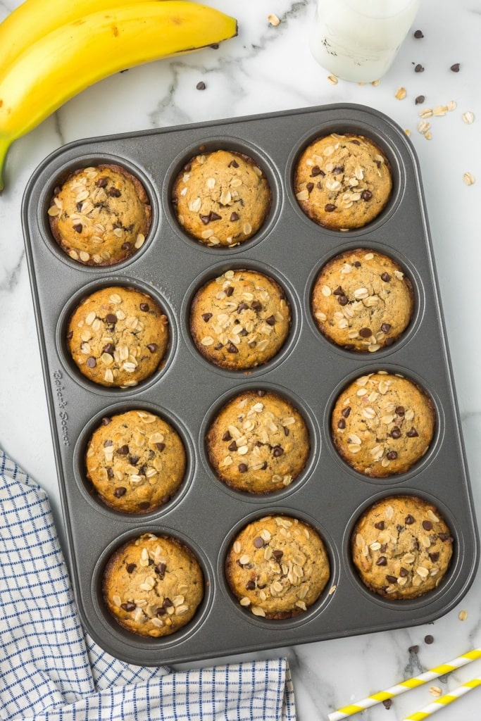 baked gluten free banana muffins with chocolate chips in a muffin tin