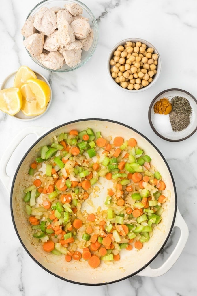 diced carrots, celery, and onions cooked in a skillet