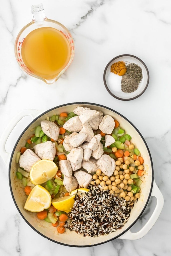 cooked turkey, vegetables, chickpeas, and wild rice in a large pot