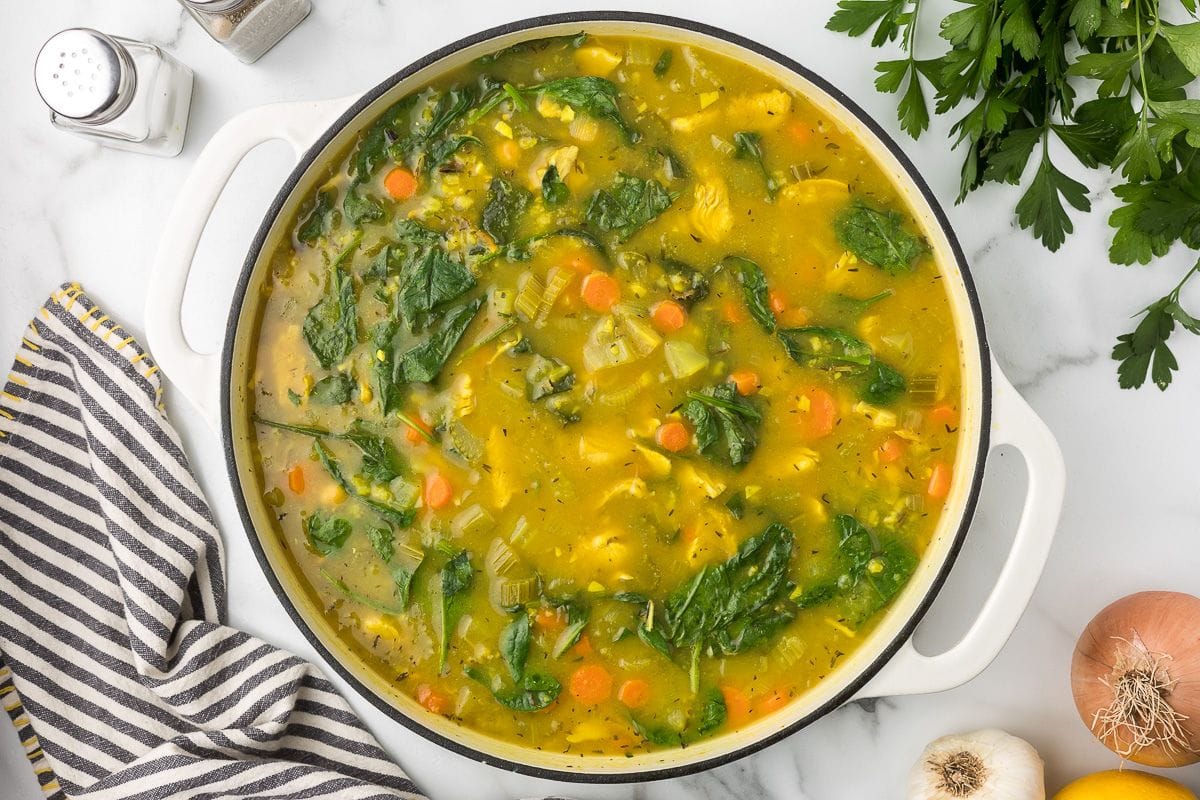 turkey rice soup with vegetables in a dutch oven