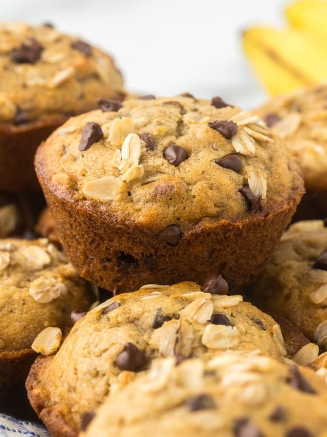 close up of a banana chocolate chip muffin with oats on top