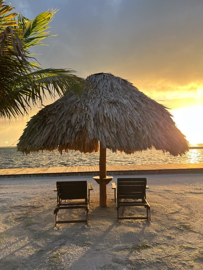 chairs under a cabana at turneffe island resort in belize