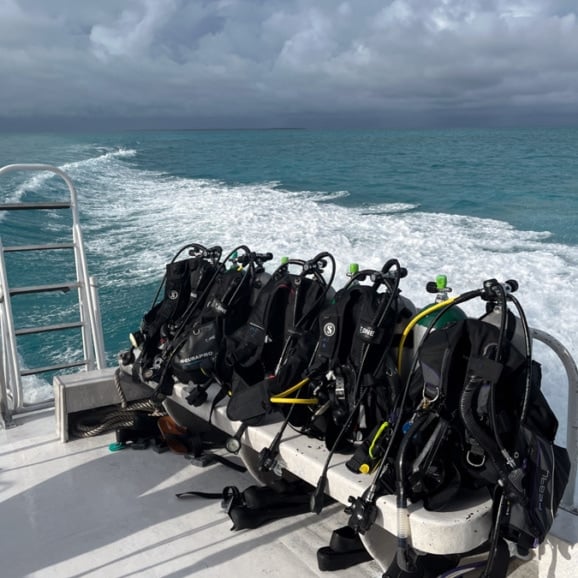 scuba diving gear ready on a boat in belize