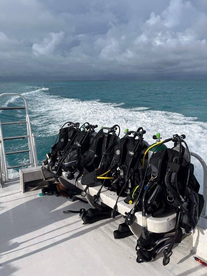 scuba diving gear ready on a boat in belize