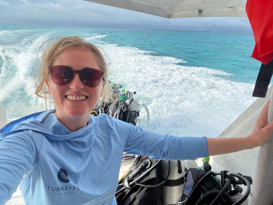 anne mauney on a scuba diving boat in belize