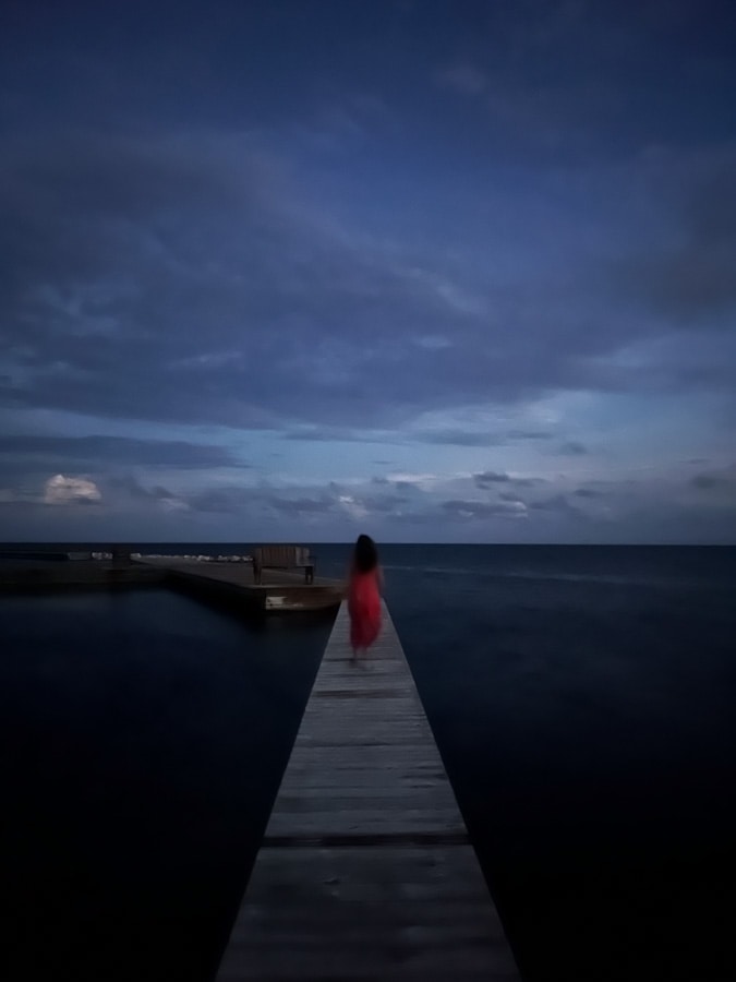 walkway over the water at turneffe island resort