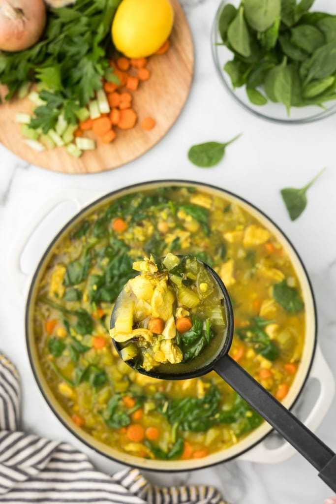 turkey and wild rice soup in a ladle