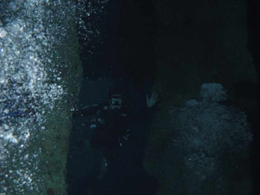 swimming through stalactites in the blue hole