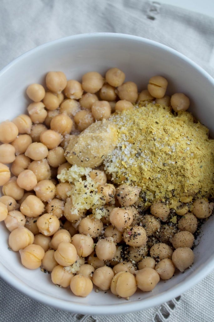 chickpeas in a bowl with dijon mustard and seasonings