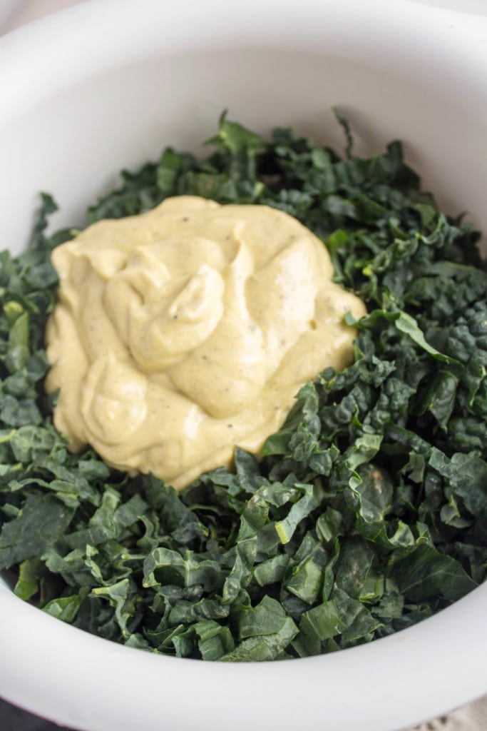 kale and vegan caesar salad dressing in a bowl