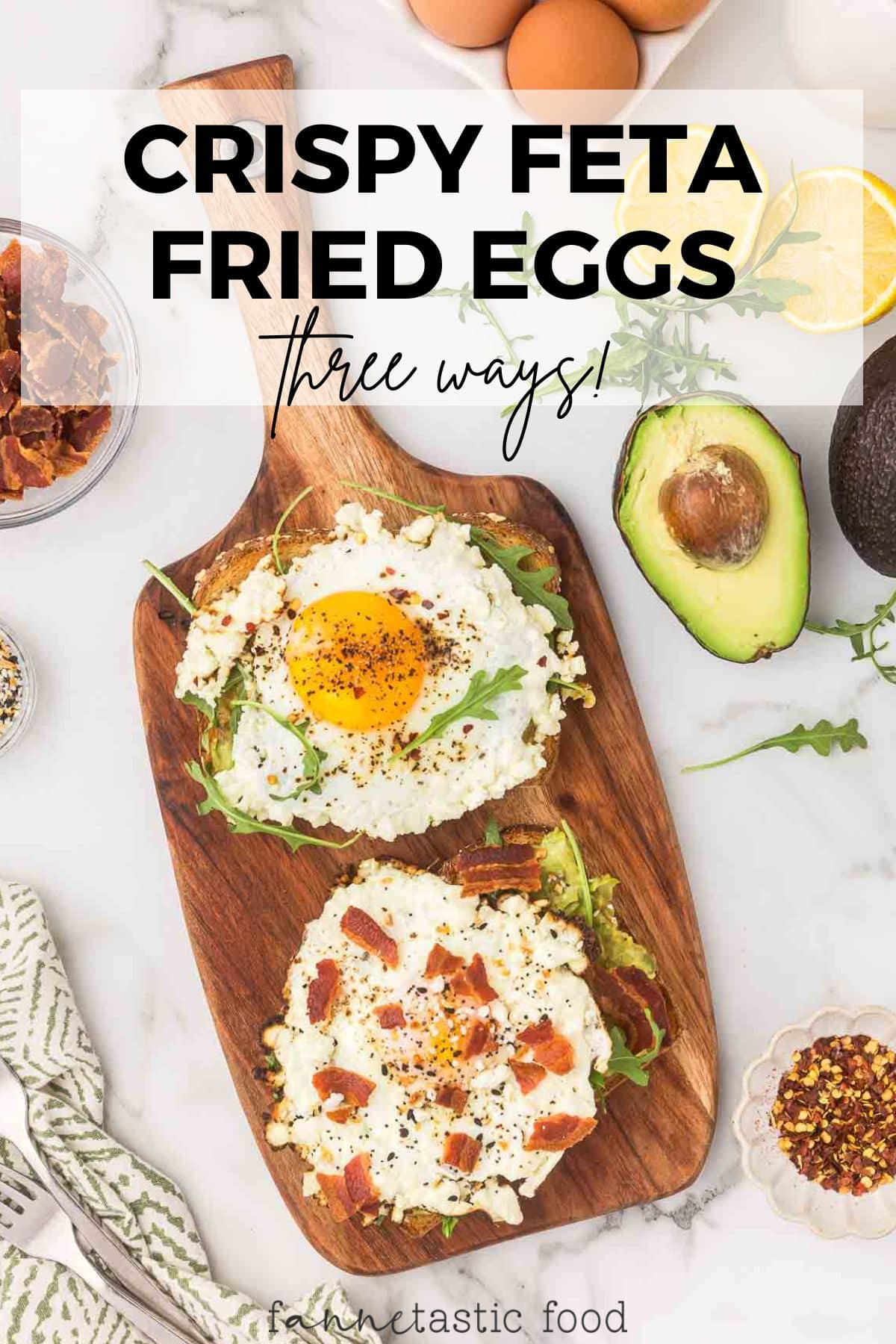 crispy feta fried eggs with avocado and bacon on a wooden platter