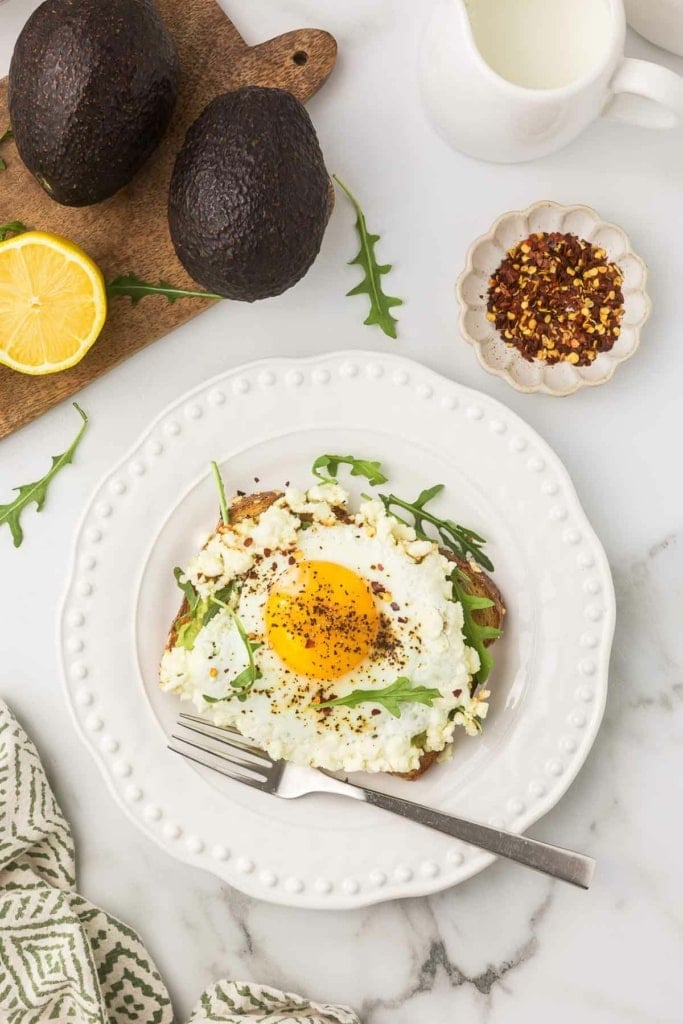 a slice of toast with a crispy feta fried egg on top