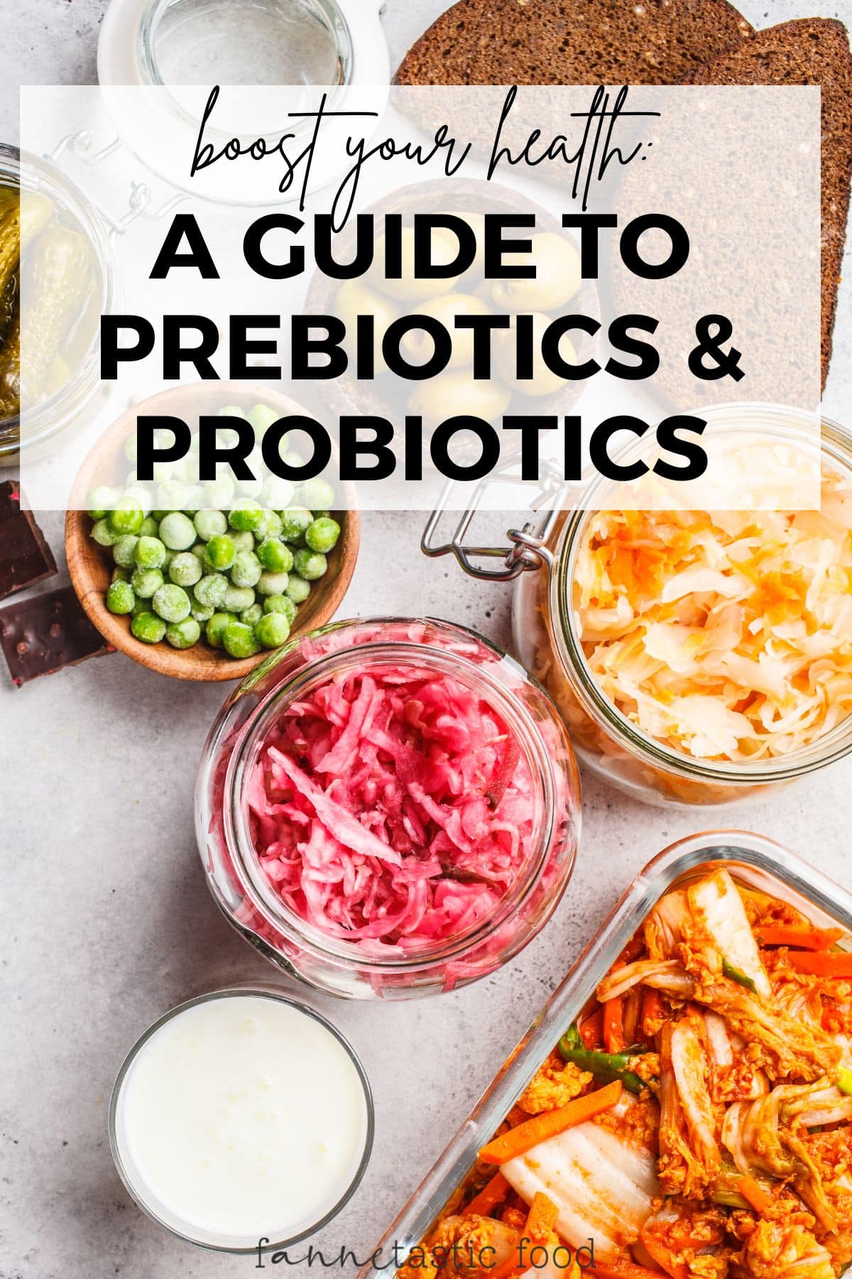prebiotic and probiotic foods like sauerkraut and kefir in small bowls on a grey surface 