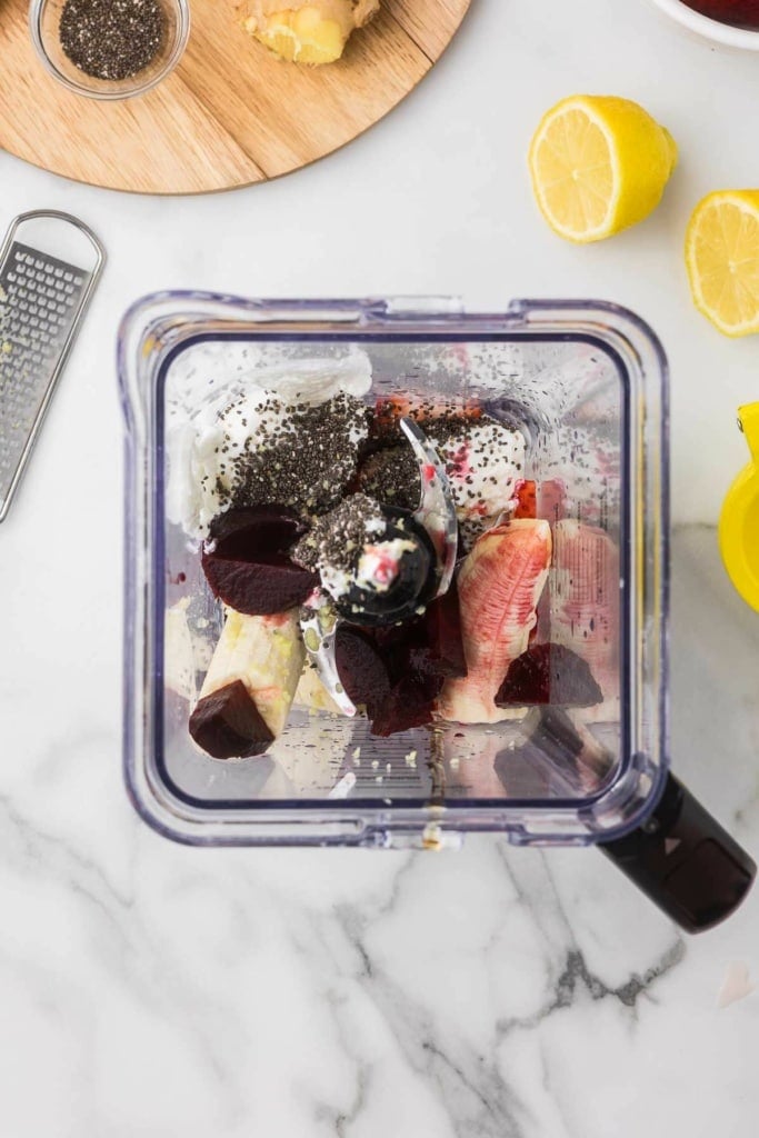 chopped beets, strawberries, and banana in a blender