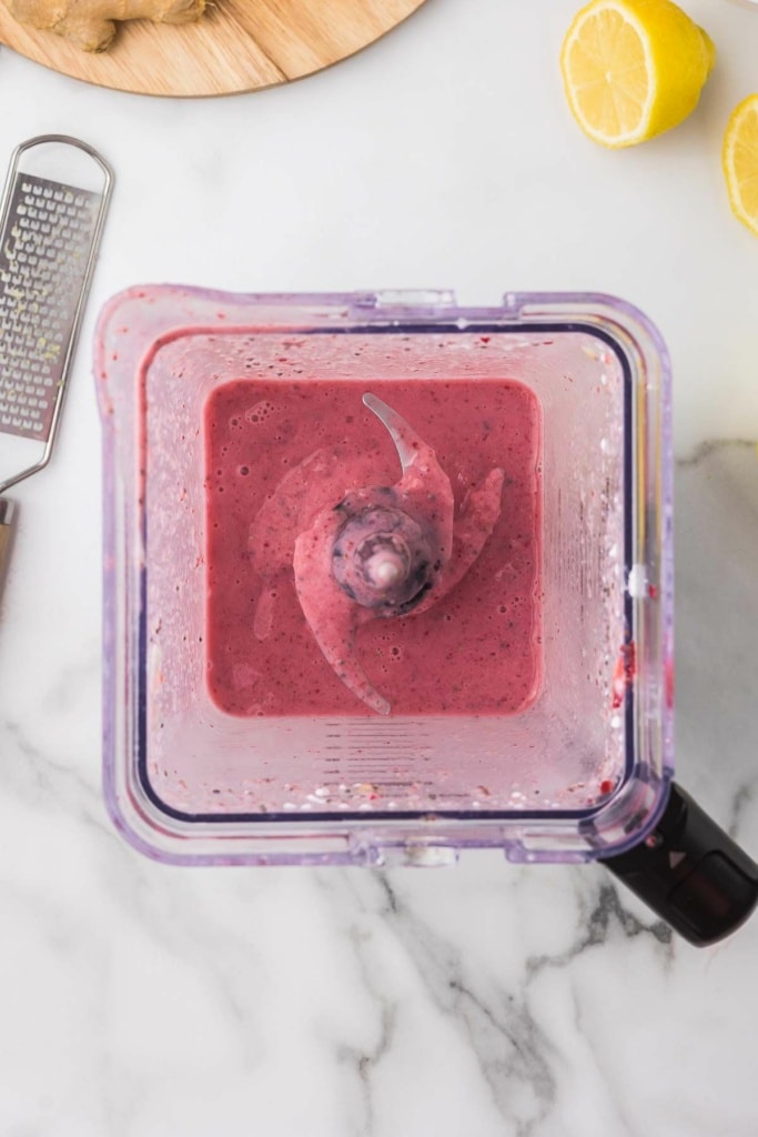 pink fruit smoothie in a blender