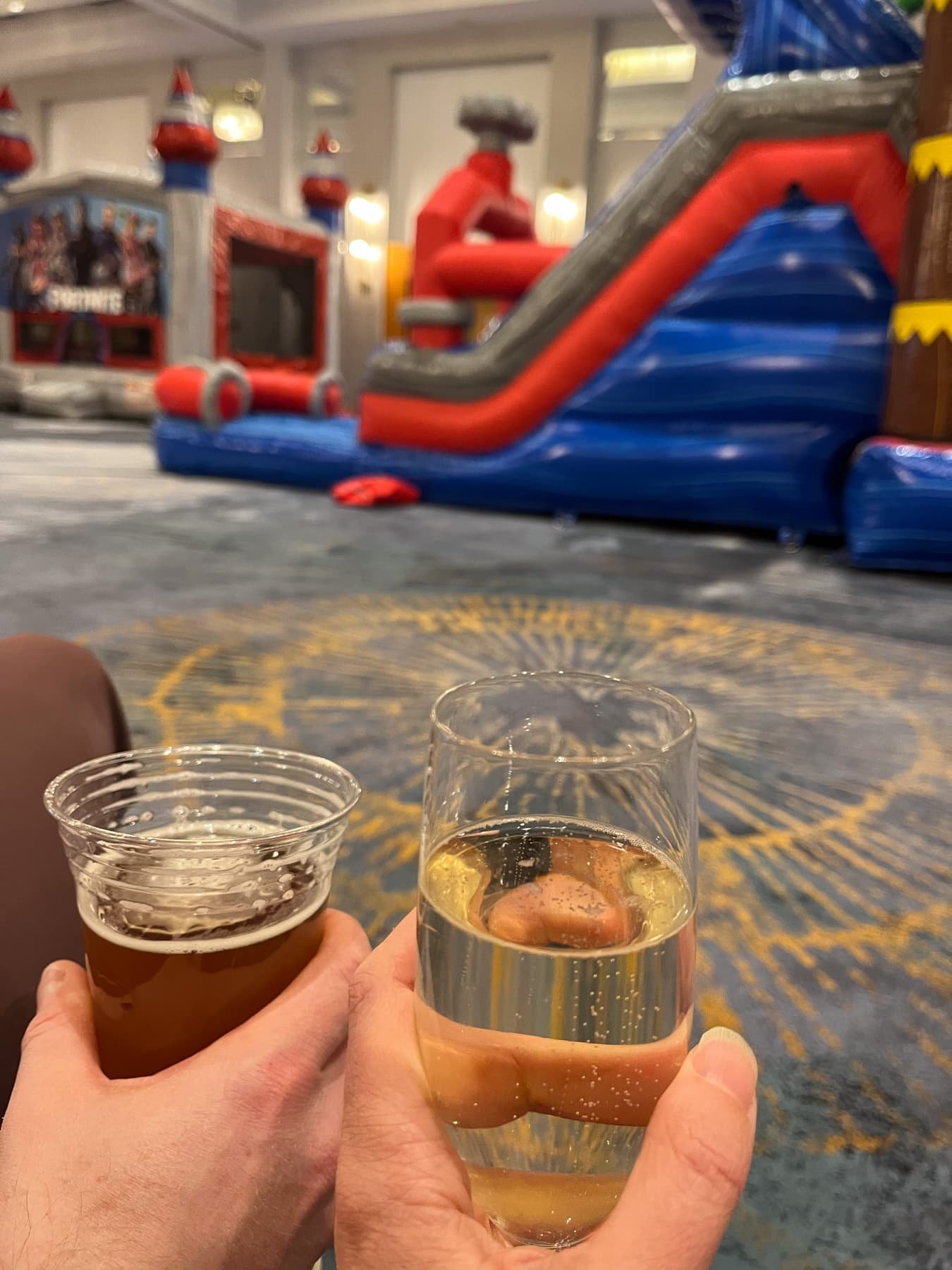 drinks with bounce house in background